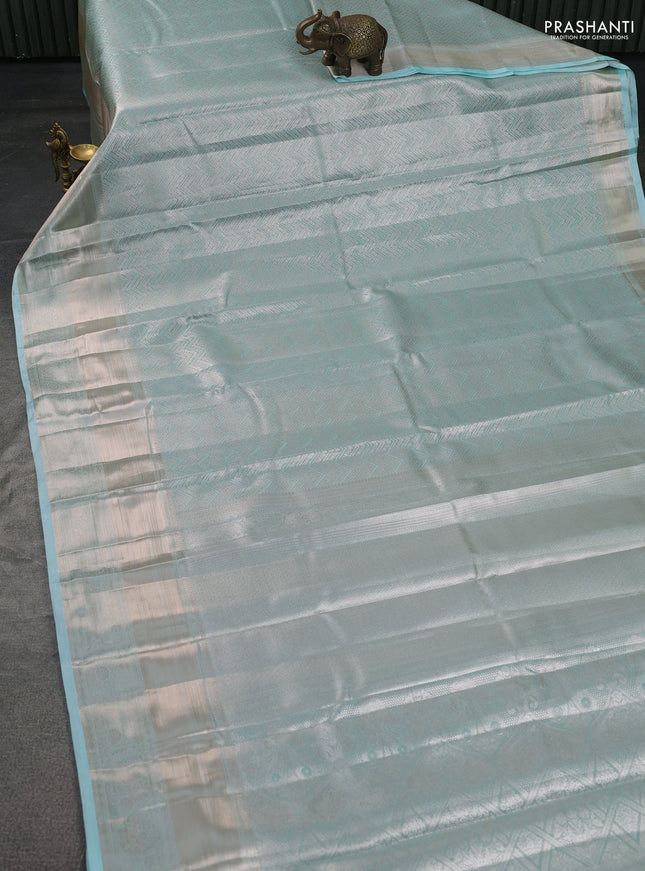 Semi kanchipuram tissue silk saree teal with allover silver zari woven brocade weaves and long zari woven border