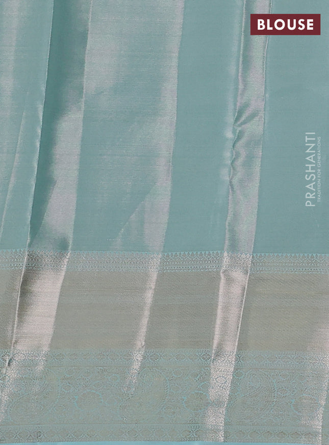 Semi kanchipuram tissue silk saree teal with allover silver zari woven brocade weaves and long zari woven border