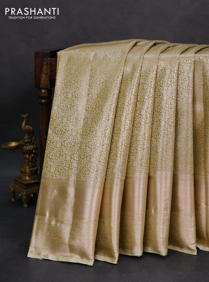 Semi kanchipuram tissue silk saree elaichi green with allover silver zari woven brocade weaves and long zari woven border