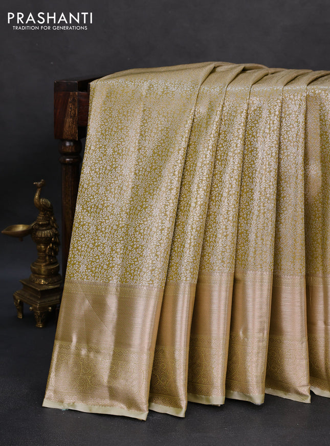 Semi kanchipuram tissue silk saree elaichi green with allover silver zari woven brocade weaves and long zari woven border