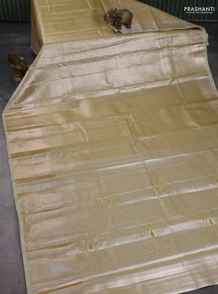 Semi kanchipuram tissue silk saree elaichi green with allover silver zari woven brocade weaves and long zari woven border