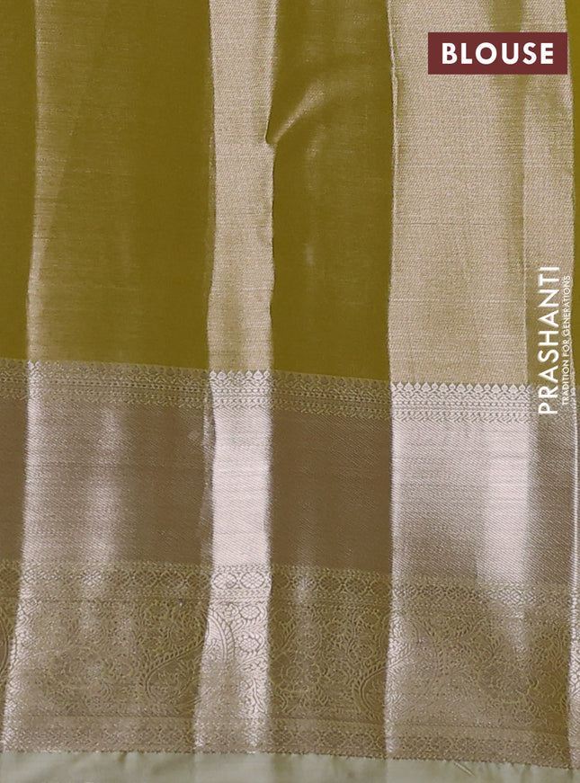 Semi kanchipuram tissue silk saree elaichi green with allover silver zari woven brocade weaves and long zari woven border