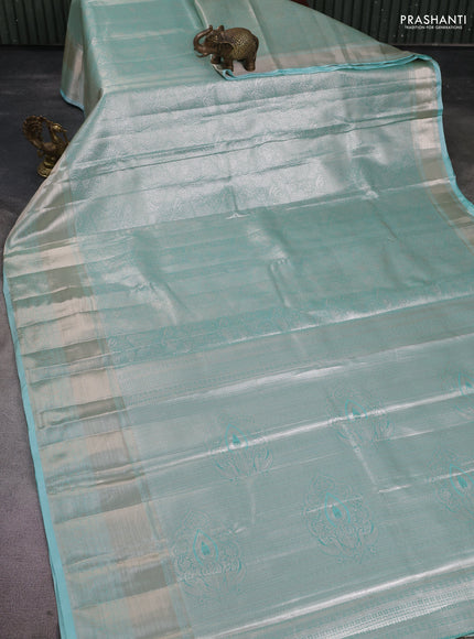 Semi kanchipuram tissue silk saree teal shade with allover silver zari woven brocade weaves and long zari woven border