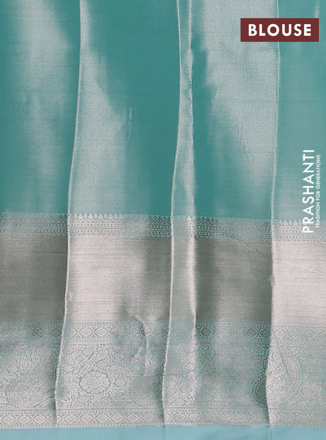 Semi kanchipuram tissue silk saree teal shade with allover silver zari woven brocade weaves and long zari woven border