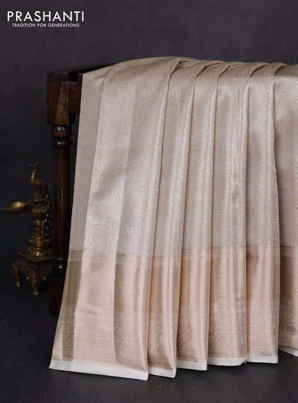 Semi kanchipuram tissue silk saree cream with allover silver zari woven brocade weaves and long zari woven border
