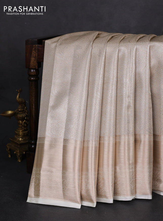Semi kanchipuram tissue silk saree cream with allover silver zari woven brocade weaves and long zari woven border