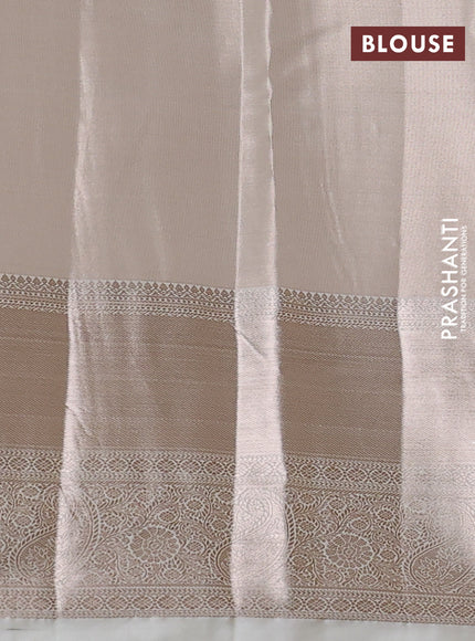Semi kanchipuram tissue silk saree cream with allover silver zari woven brocade weaves and long zari woven border
