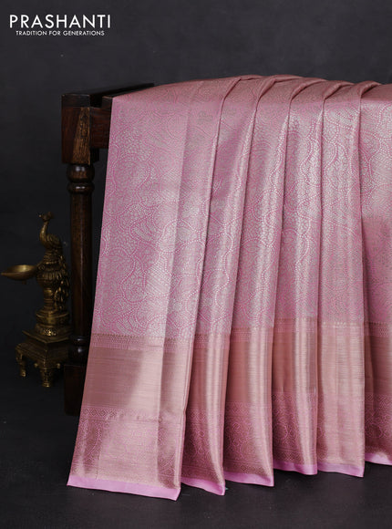 Semi kanchipuram tissue silk saree light pink with allover silver zari woven brocade weaves and long zari woven border