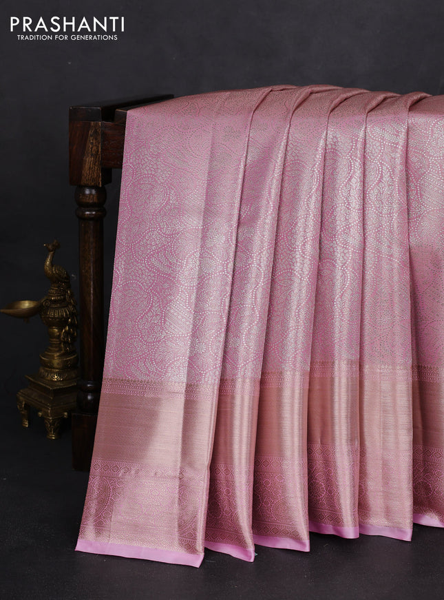 Semi kanchipuram tissue silk saree light pink with allover silver zari woven brocade weaves and long zari woven border