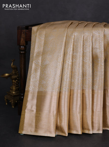 Semi kanchipuram tissue silk saree sandal with allover silver zari woven brocade weaves and long zari woven border