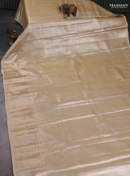 Semi kanchipuram tissue silk saree sandal with allover silver zari woven brocade weaves and long zari woven border