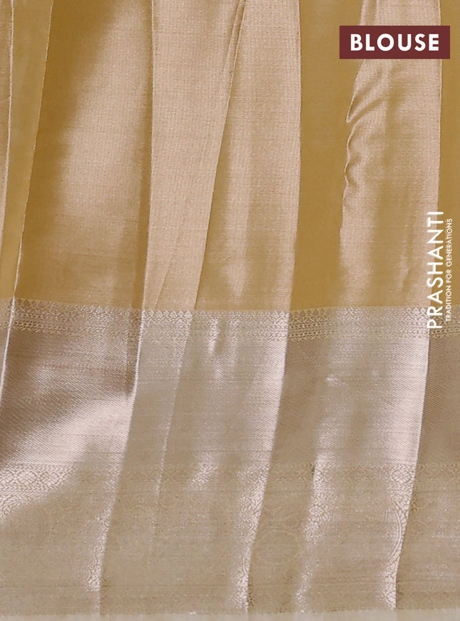 Semi kanchipuram tissue silk saree sandal with allover silver zari woven brocade weaves and long zari woven border