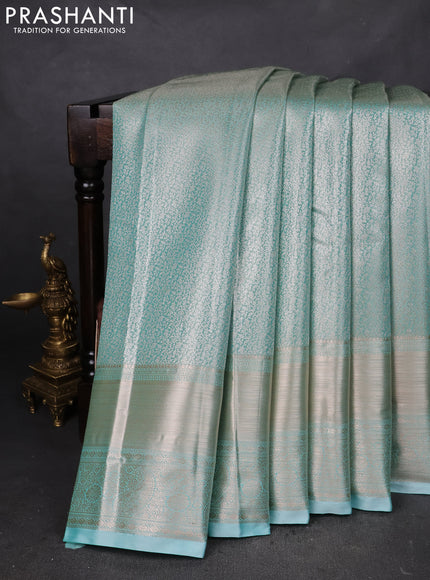 Semi kanchipuram tissue silk saree teal blue with allover silver zari woven brocade weaves and long zari woven border