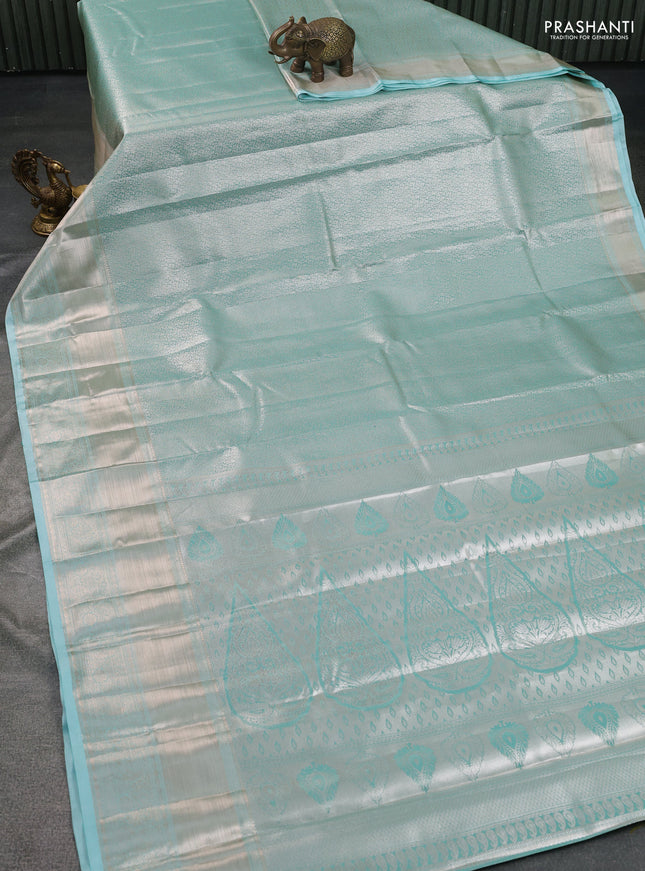 Semi kanchipuram tissue silk saree teal blue with allover silver zari woven brocade weaves and long zari woven border