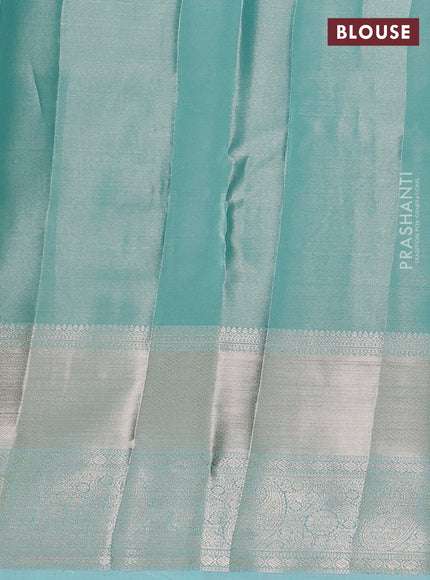 Semi kanchipuram tissue silk saree teal blue with allover silver zari woven brocade weaves and long zari woven border