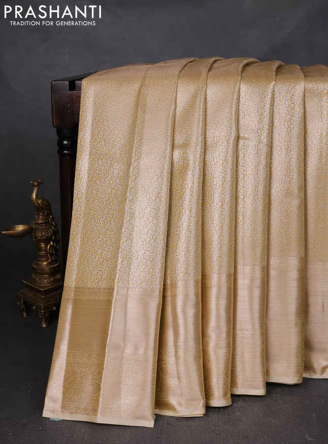 Semi kanchipuram tissue silk saree sandal with allover silver zari woven brocade weaves and long zari woven border