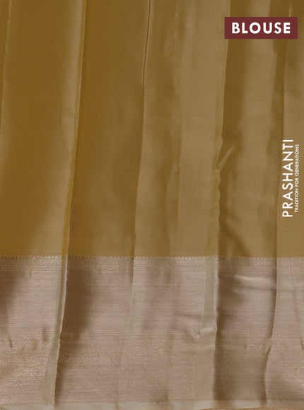 Semi kanchipuram tissue silk saree sandal with allover silver zari woven brocade weaves and long zari woven border