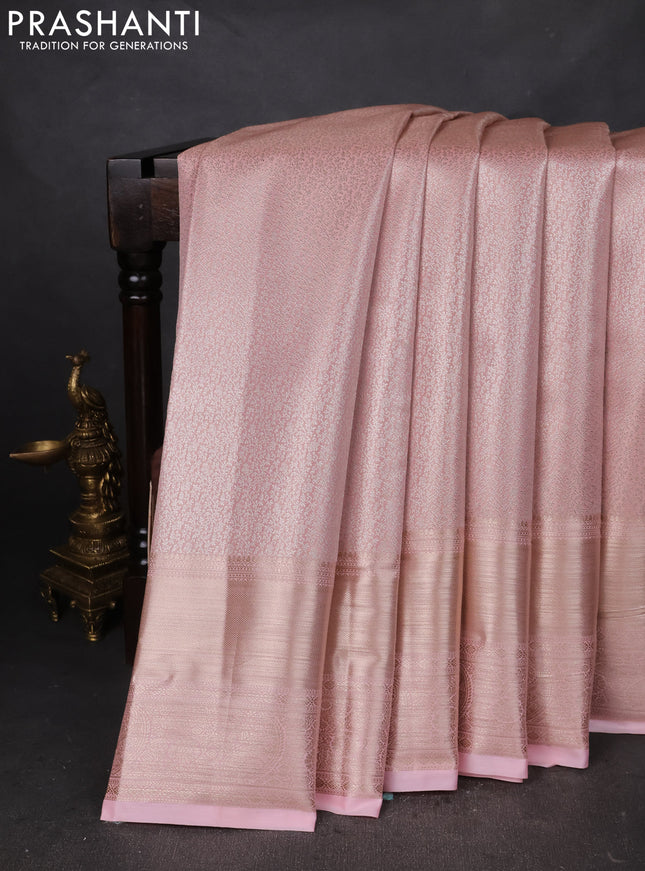 Semi kanchipuram tissue silk saree mild peach with allover silver zari woven brocade weaves and long zari woven border