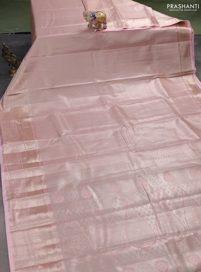 Semi kanchipuram tissue silk saree mild peach with allover silver zari woven brocade weaves and long zari woven border
