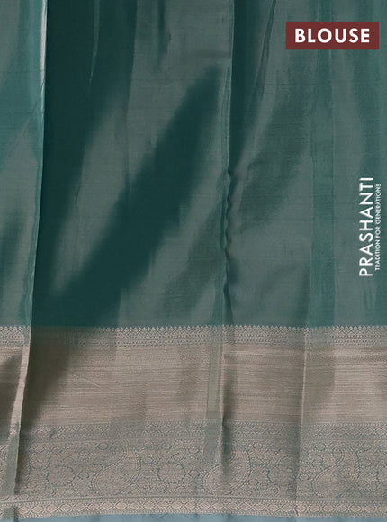 Semi kanchipuram tissue silk saree teal with allover silver zari woven brocade weaves and long zari woven border