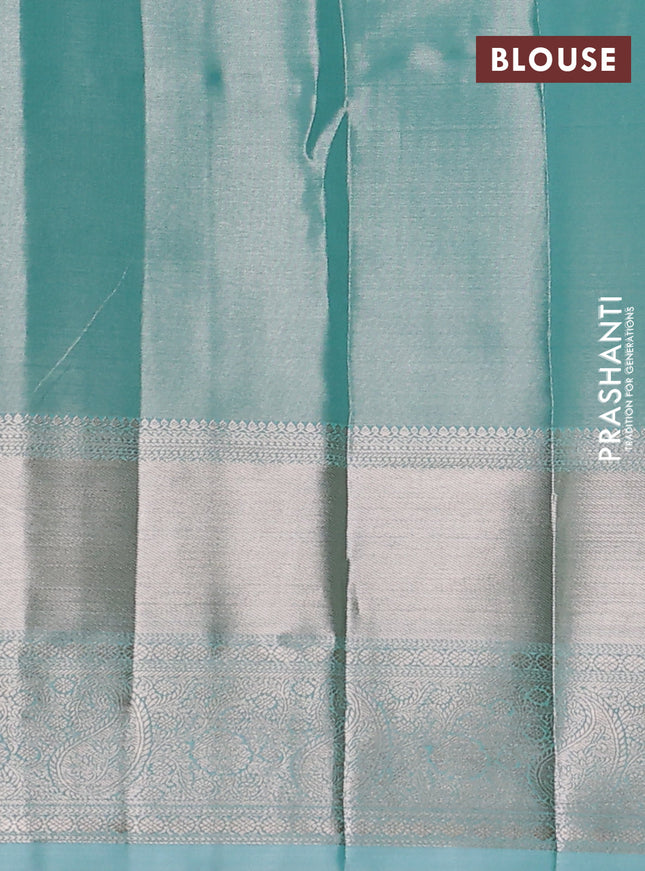Semi kanchipuram tissue silk saree teal blue with allover silver zari woven brocade weaves and long zari woven border