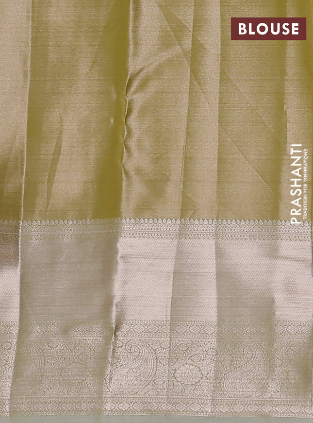 Semi kanchipuram tissue silk saree lime green shade and elaichi green with allover silver zari woven brocade weaves and long zari woven border