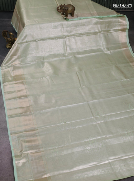 Semi kanchipuram tissue silk saree pista green with allover silver zari woven brocade weaves and long zari woven border