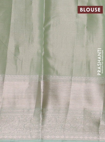 Semi kanchipuram tissue silk saree pista green with allover silver zari woven brocade weaves and long zari woven border