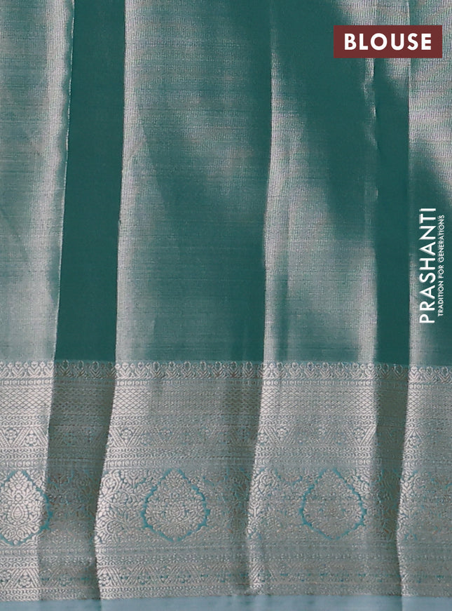 Semi kanchipuram tissue silk saree teal shade with allover silver zari woven brocade weaves and zari woven border