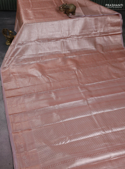 Semi kanchipuram tissue silk saree peach shade with allover silver zari woven brocade weaves and zari woven border
