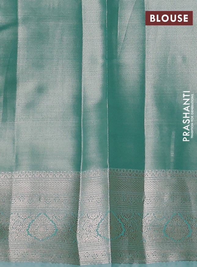 Semi kanchipuram tissue silk saree teal shade with allover silver zari woven brocade weaves and zari woven border