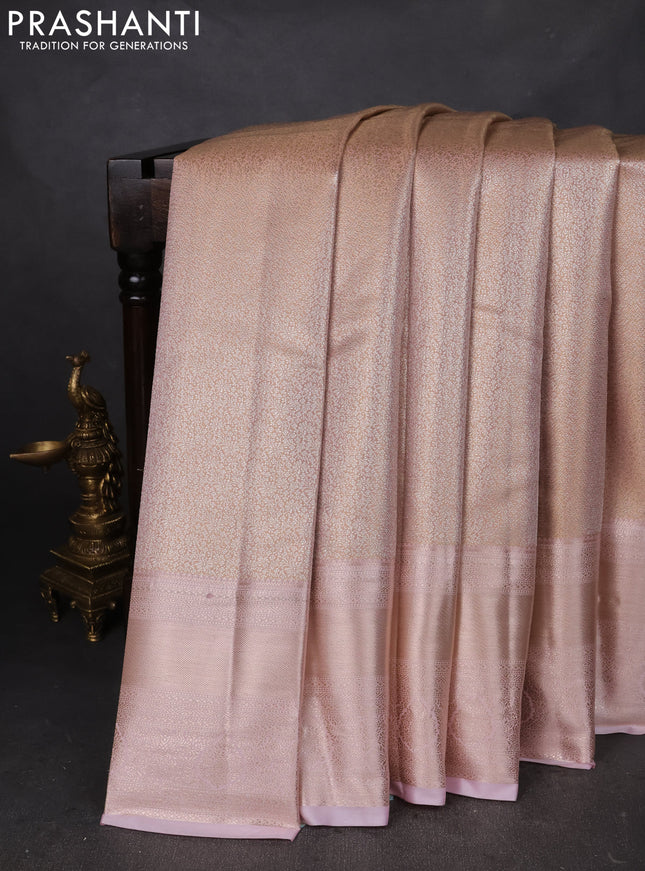 Semi kanchipuram tissue silk saree pastel peach and baby pink with allover silver zari woven brocade weaves and long zari woven border