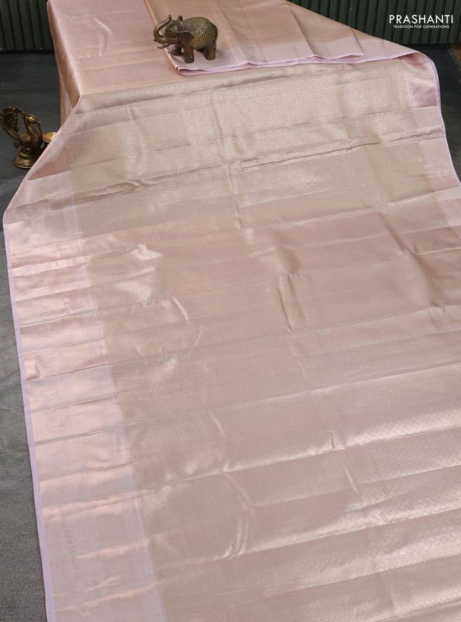 Semi kanchipuram tissue silk saree pastel peach and baby pink with allover silver zari woven brocade weaves and long zari woven border