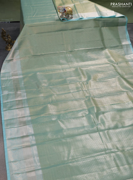Semi kanchipuram tissue silk saree teal shade with allover silver zari woven brocade weaves and long zari woven border