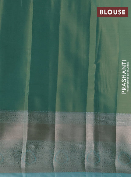 Semi kanchipuram tissue silk saree teal shade with allover silver zari woven brocade weaves and long zari woven border