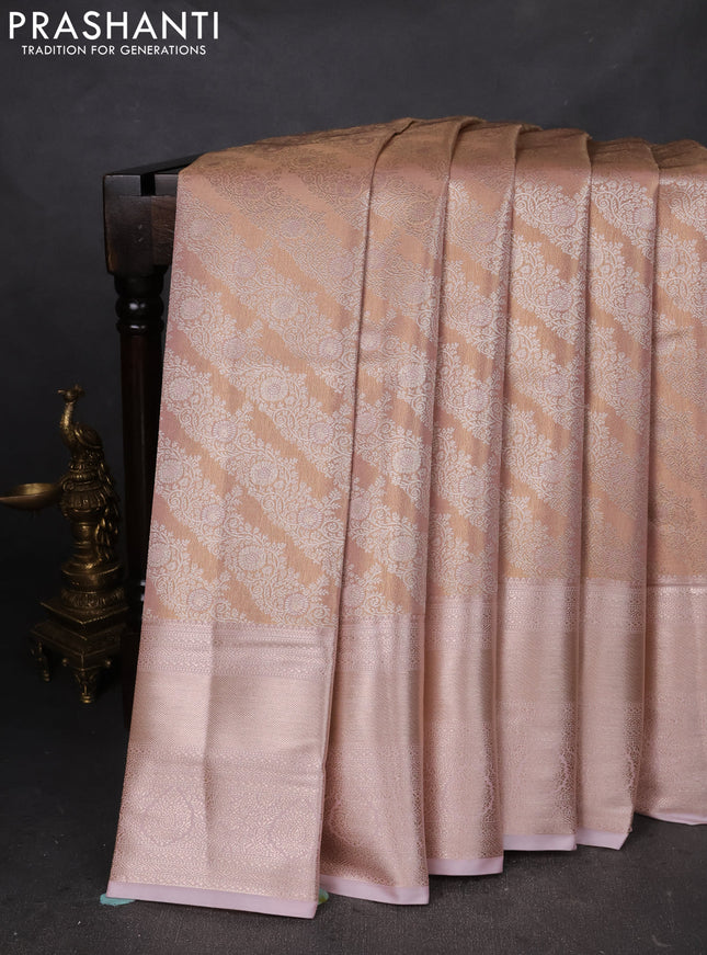 Semi kanchipuram tissue silk saree pastel peach and baby pink with allover silver zari woven brocade weaves and long zari woven border