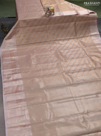 Semi kanchipuram tissue silk saree pastel peach and baby pink with allover silver zari woven brocade weaves and long zari woven border