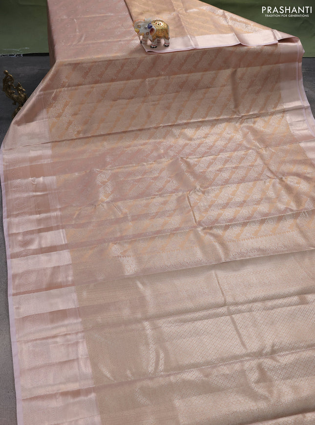 Semi kanchipuram tissue silk saree pastel peach and baby pink with allover silver zari woven brocade weaves and long zari woven border