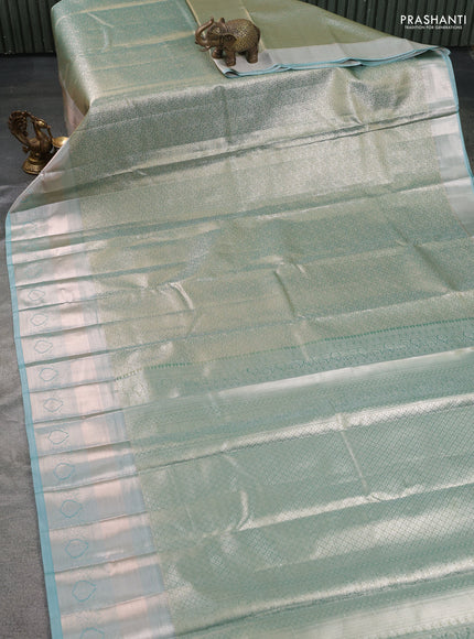 Semi kanchipuram tissue silk saree dual shade of green and teal with allover silver zari woven brocade weaves and long zari woven border