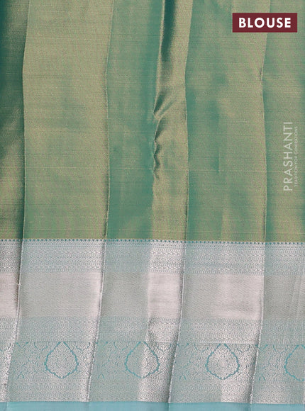 Semi kanchipuram tissue silk saree dual shade of green and teal with allover silver zari woven brocade weaves and long zari woven border