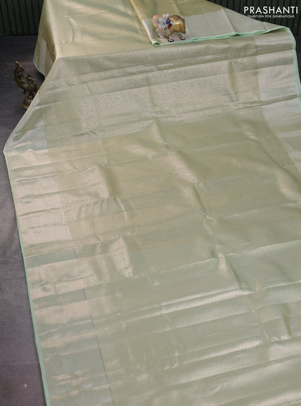 Semi kanchipuram tissue silk saree pista green with allover silver zari woven brocade weaves and long zari woven border