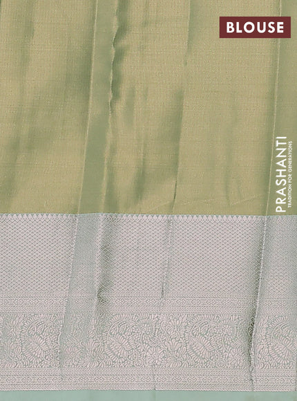 Semi kanchipuram tissue silk saree pista green with allover silver zari woven brocade weaves and long zari woven border