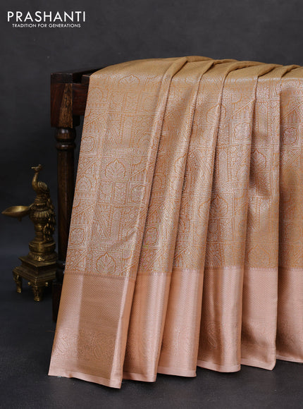 Semi kanchipuram tissue silk saree sandal and pastel peach with allover silver zari woven brocade weaves and zari woven border
