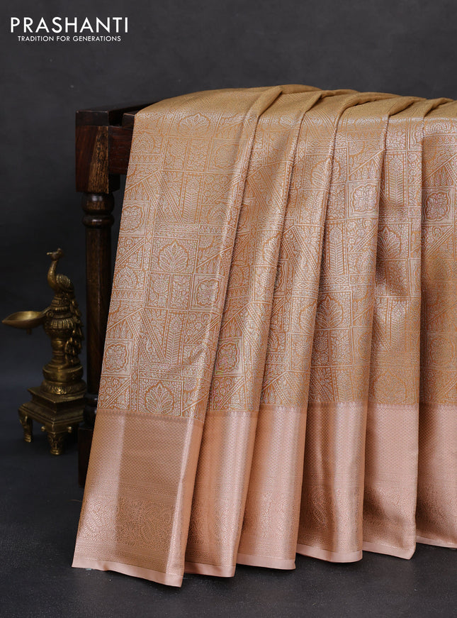 Semi kanchipuram tissue silk saree sandal and pastel peach with allover silver zari woven brocade weaves and zari woven border