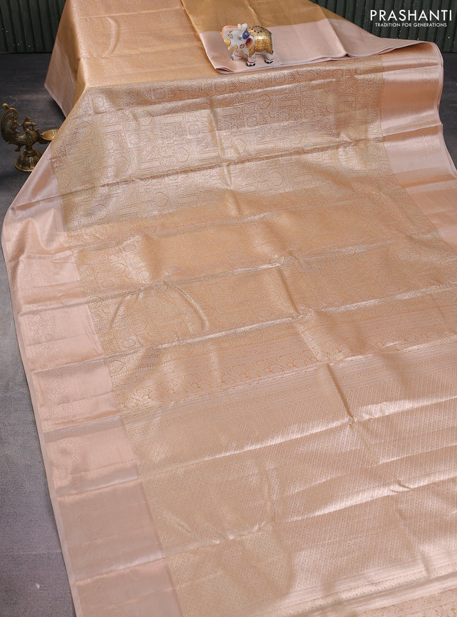 Semi kanchipuram tissue silk saree sandal and pastel peach with allover silver zari woven brocade weaves and zari woven border