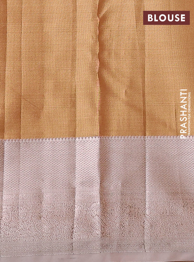 Semi kanchipuram tissue silk saree sandal and pastel peach with allover silver zari woven brocade weaves and zari woven border