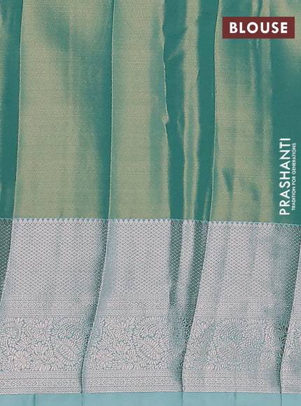 Semi kanchipuram tissue silk saree dual shade of teal with allover silver zari woven brocade weaves and zari woven border