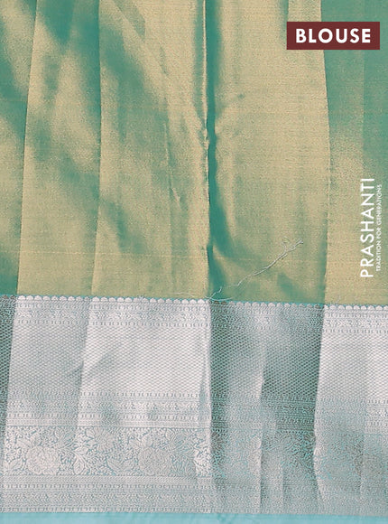 Semi kanchipuram tissue silk saree dual shade of teal with allover silver zari woven brocade weaves and long zari woven border