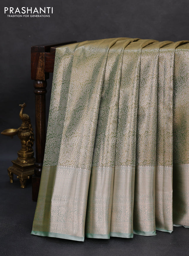 Semi kanchipuram tissue silk saree light green with allover silver zari woven brocade weaves and long zari woven border