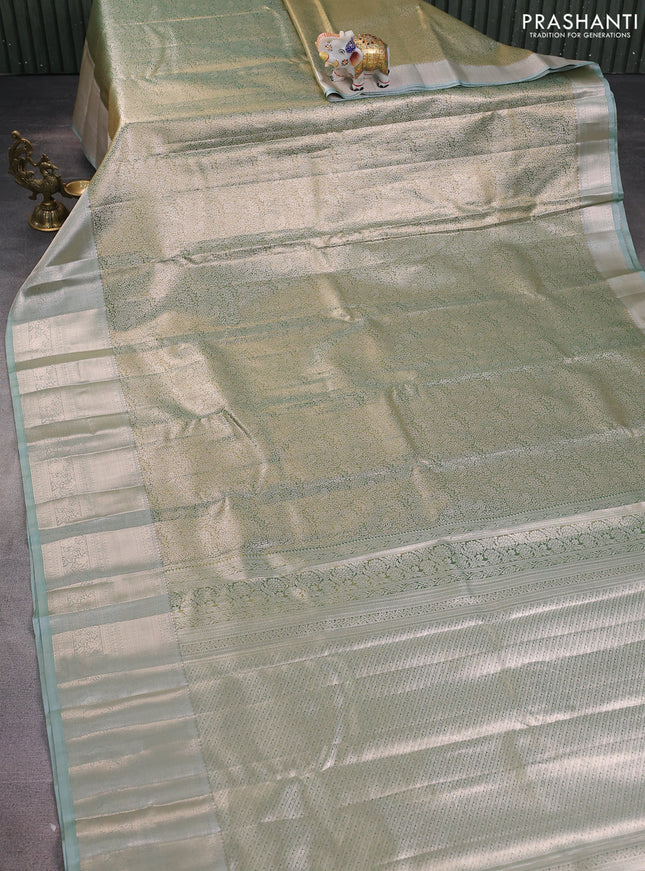 Semi kanchipuram tissue silk saree light green with allover silver zari woven brocade weaves and long zari woven border